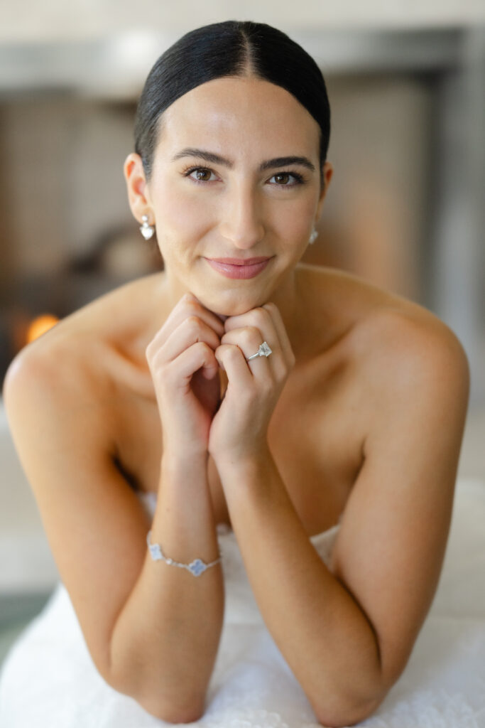 Bride portrait at Carneros Resort and Spa featuring a bride with sleek hair and natural makeup, photographed indoors with soft light in Napa Valley wine country