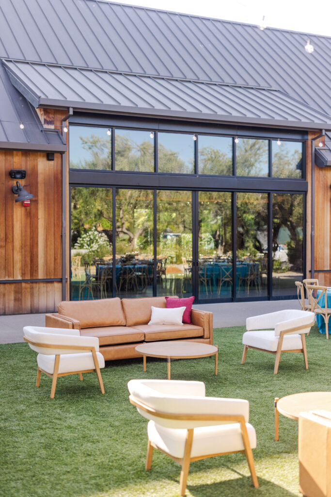 Outdoor lounge area at The Social at Estate Yountville with modern seating and garden setting