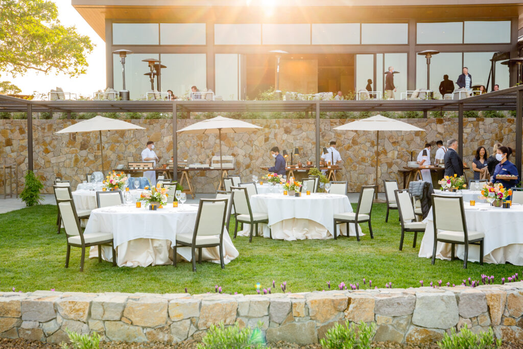 Outdoor lawn reception with sunset views at Montage Healdsburg wedding venue