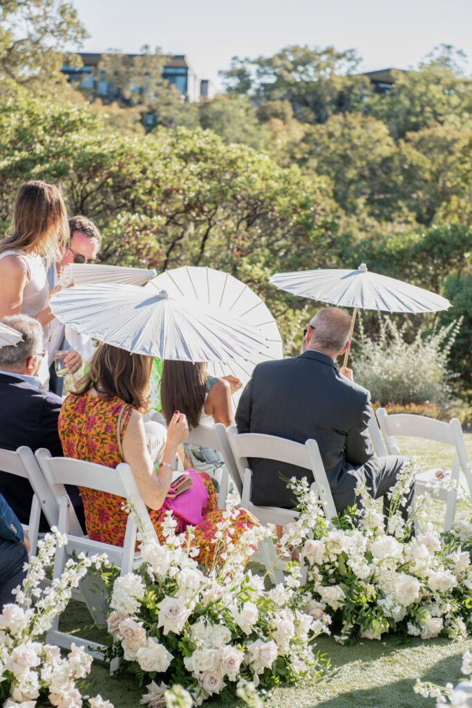 Guests seated at outdoor wedding ceremony overlooking hills at Montage Healdsburg