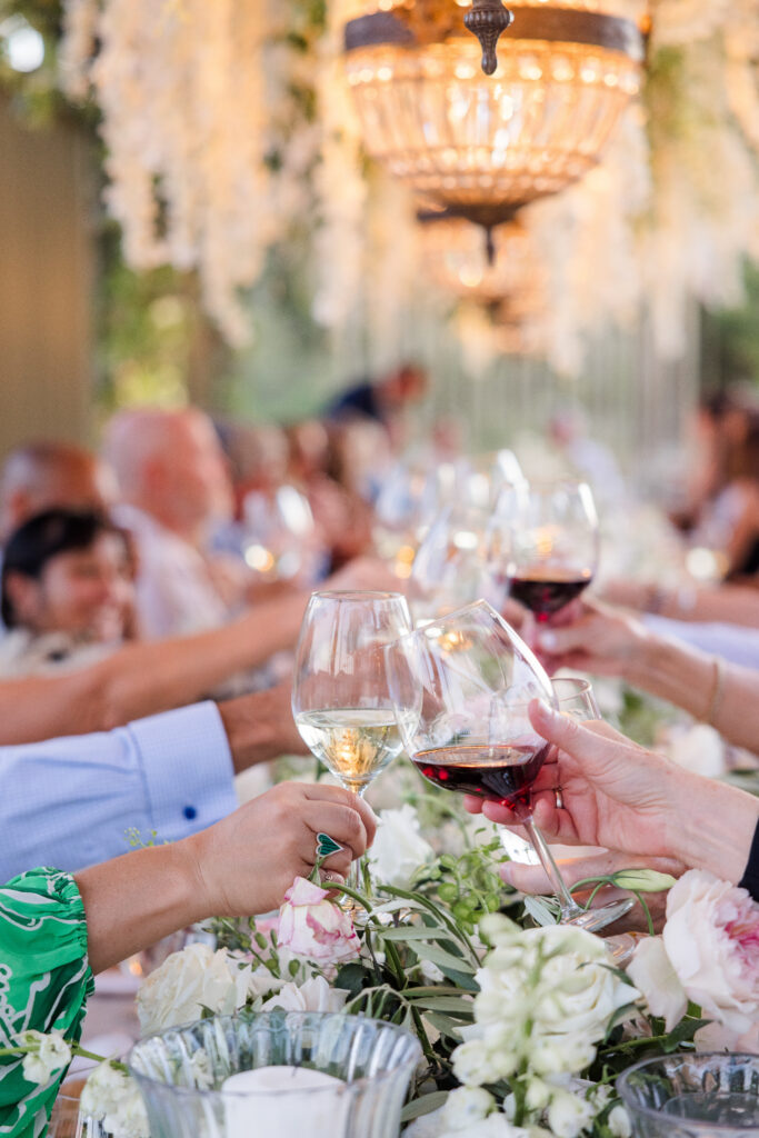 Guests toasting with wine during elegant reception at Montage Healdsburg
